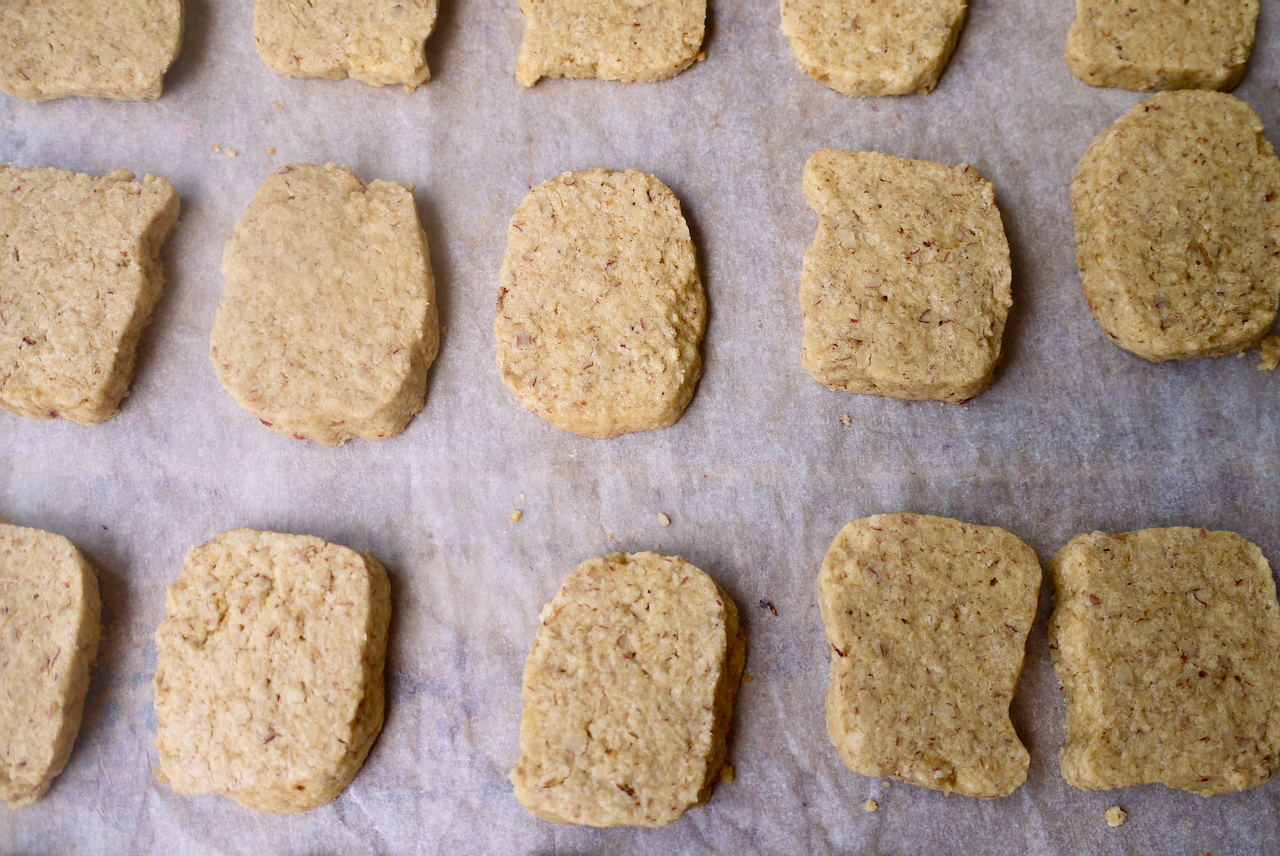 biscuits, evenly spaced on a sheet of baking paper