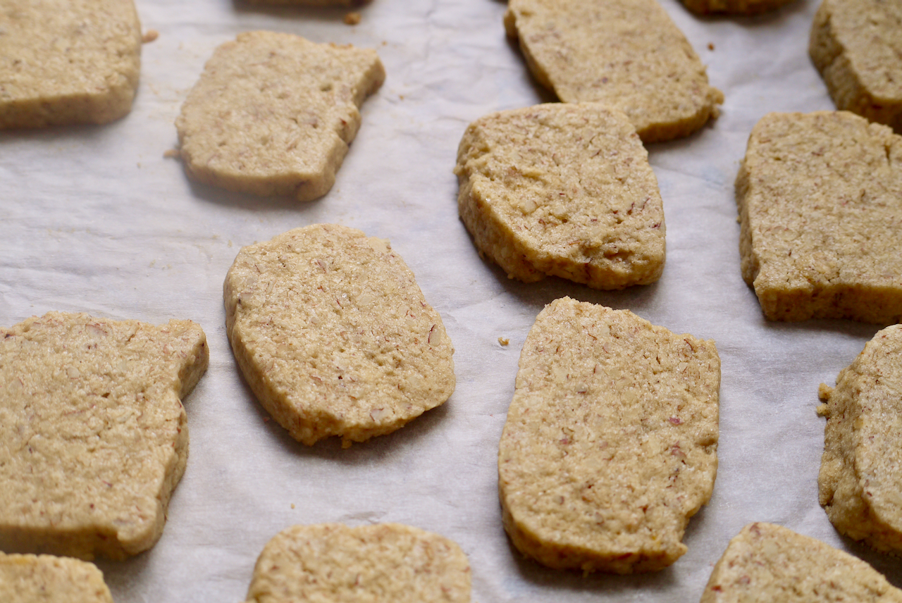 Close up of biscuits on a sheet of baking paper