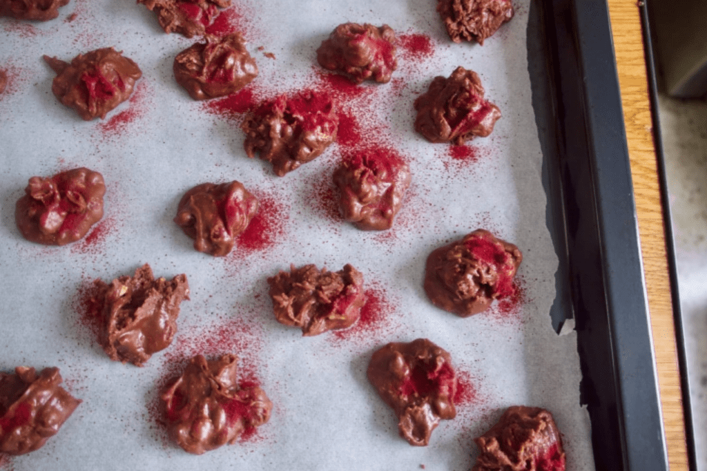 Chocolate candies dusted with red plum powder. This image links through to a web page with this recipe.