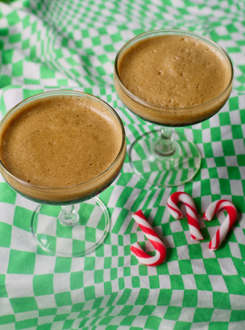 espresso martinis and mini candy canes on a green checked background