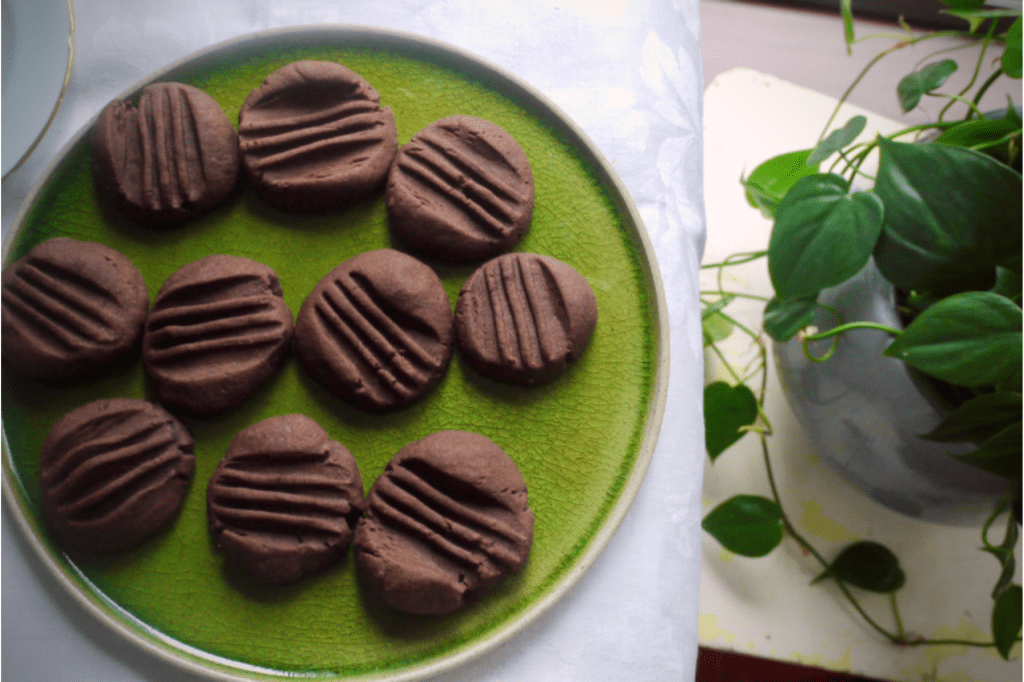 Chocolate cookies on a green plate. This image links through to a web page with the recipe.