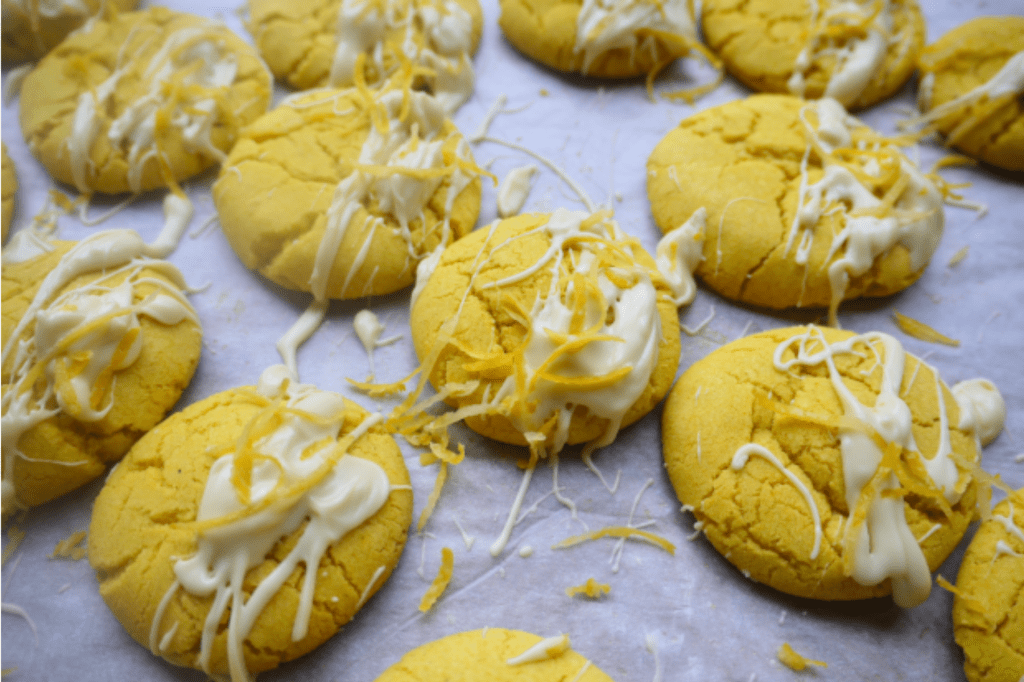 Lemon cookies drizzled in white chocolate. This image links through to a web page with the recipe.