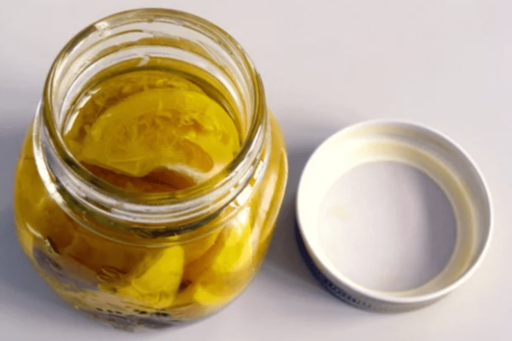 A jar of preserved limes. This image links through to a web page with the recipe.