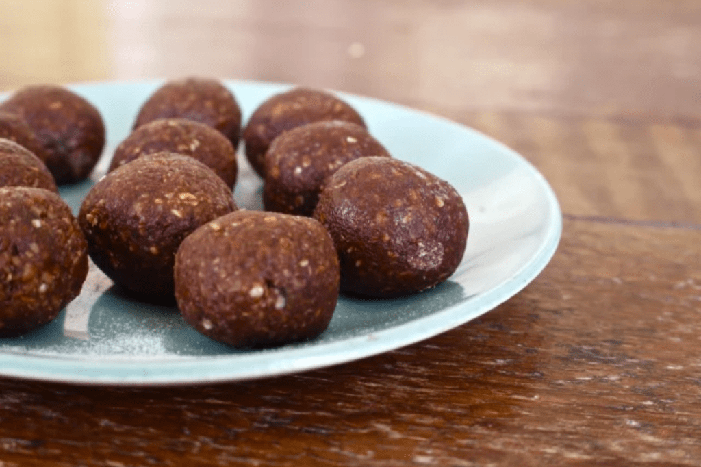 Chocolate truffles on a green plate. This image links through to a web page with this recipe.