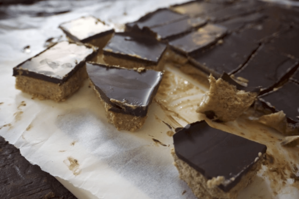 Squares of chocolate cashew slice. This image links through to a web page with this recipe.