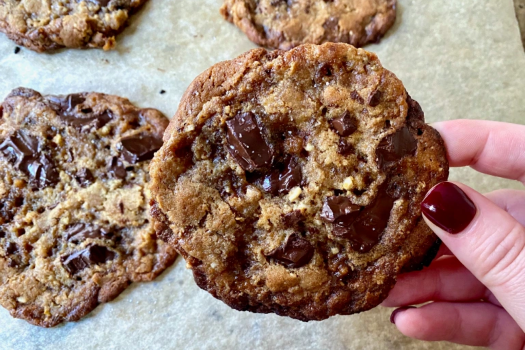 A hand holding a cookie. This image links through to a web page with the recipe.