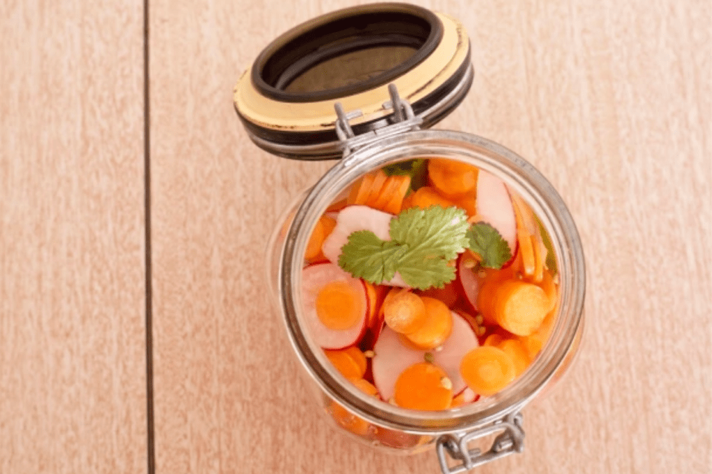 An open jar of pickles. This image links through to a web page with the recipe.