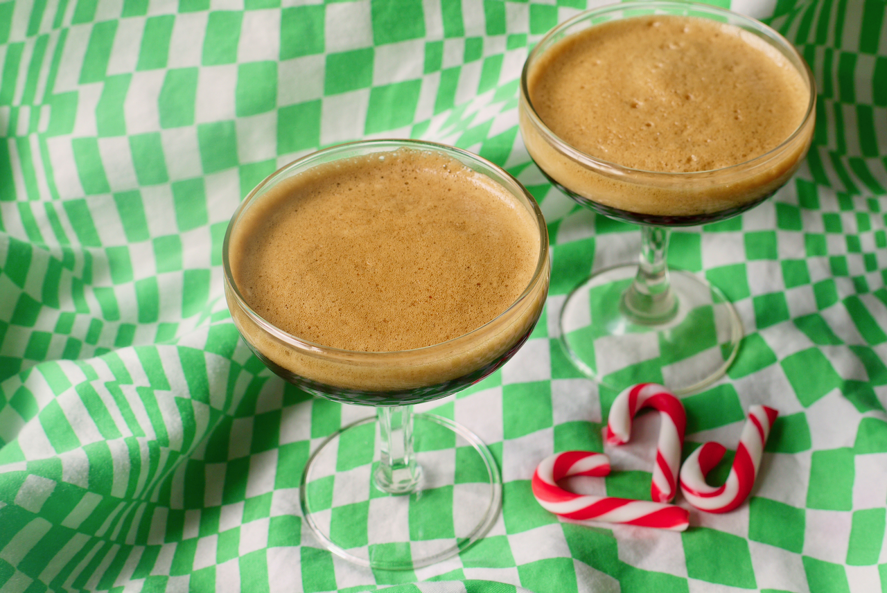 two espresso martinis on a green checked background