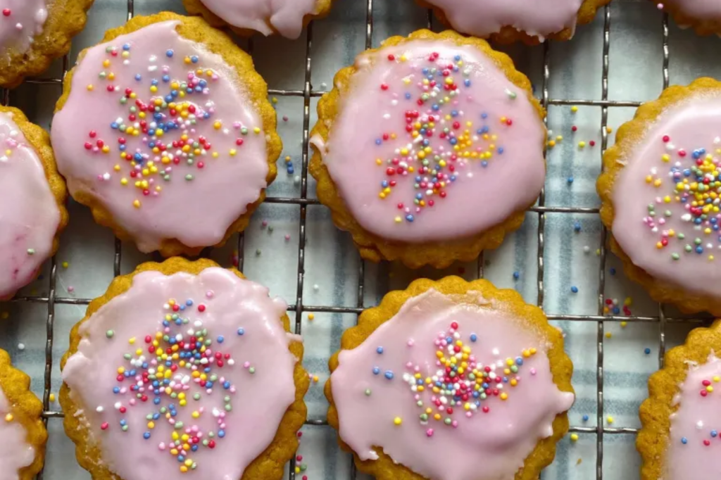 Pink iced biscuits. This image links through to a web page with the recipe.