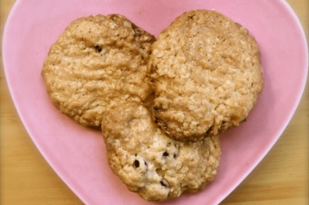 Cookies on a pink heart plate. This image links through to a web page with the recipe.