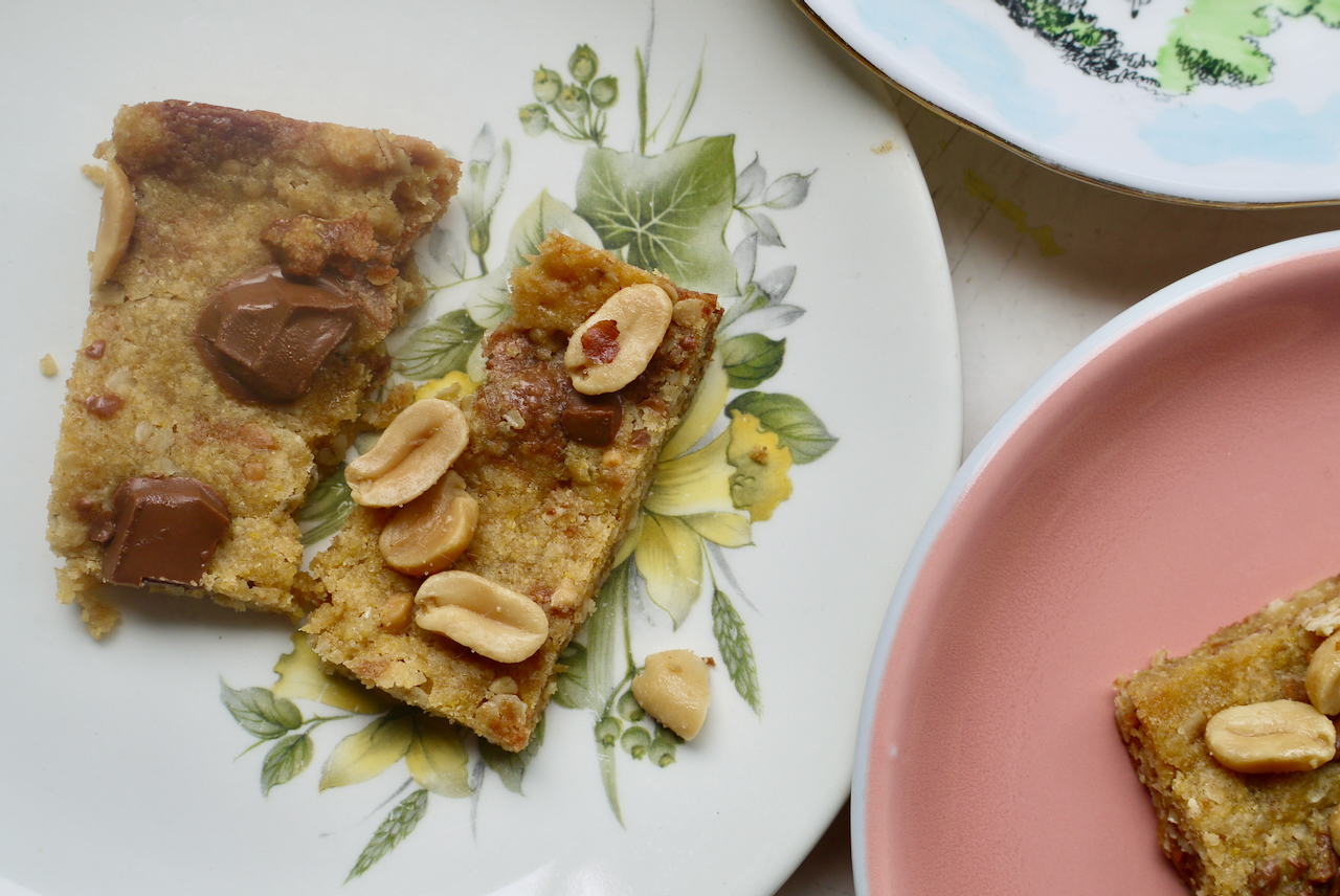 A peanut butter chocolate chunk square broken in half