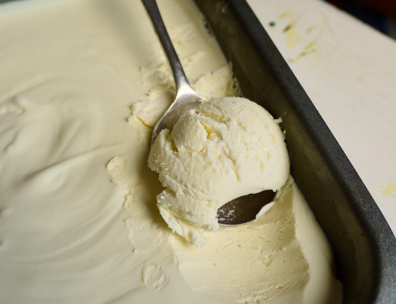 A spoon with a scoop of ice cream