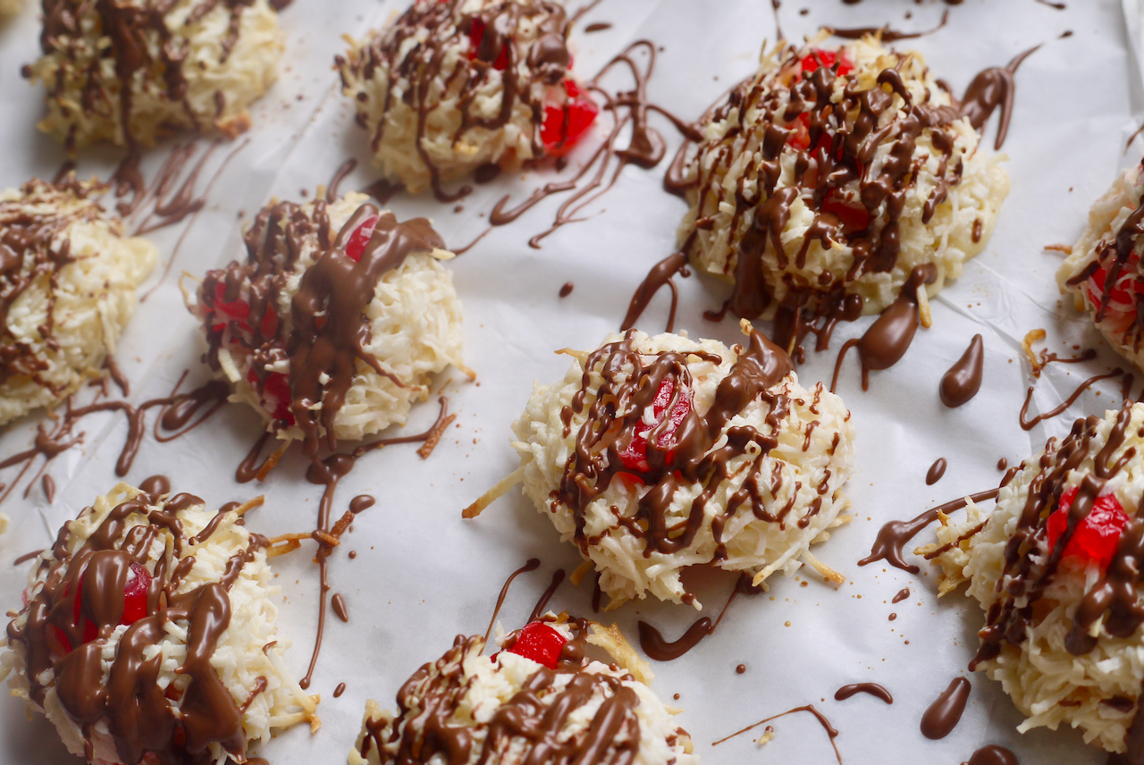 Chocolate drizzled over cherry macaroons