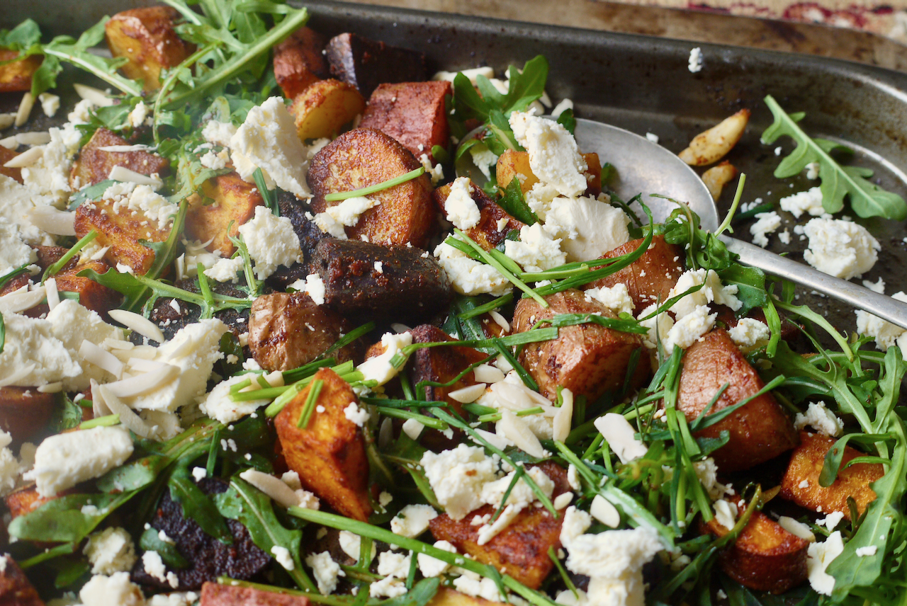 roasted vegetables and feta on a roasting dish