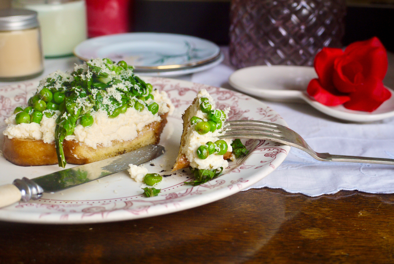 A fork with a sliced piece of toast on it