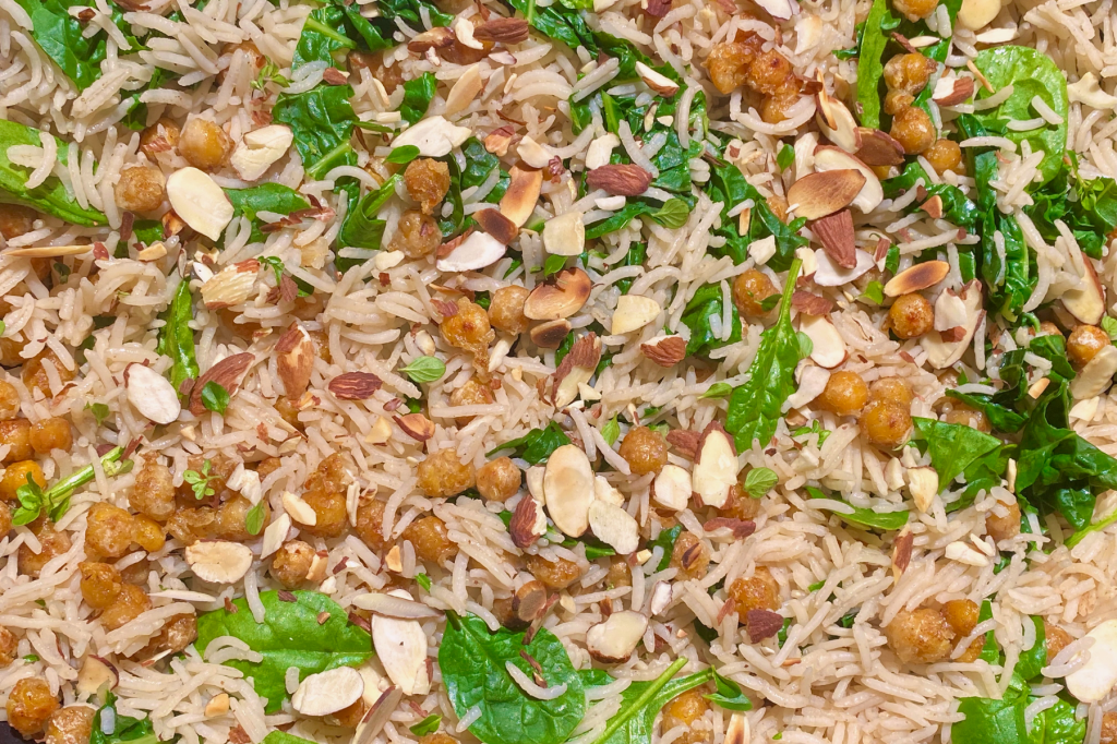 Close-up of rice, chickpeas, greens and almonds. This image links to a web page with this recipe.