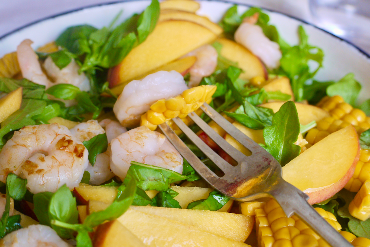 A forkful of corn and prawn salad