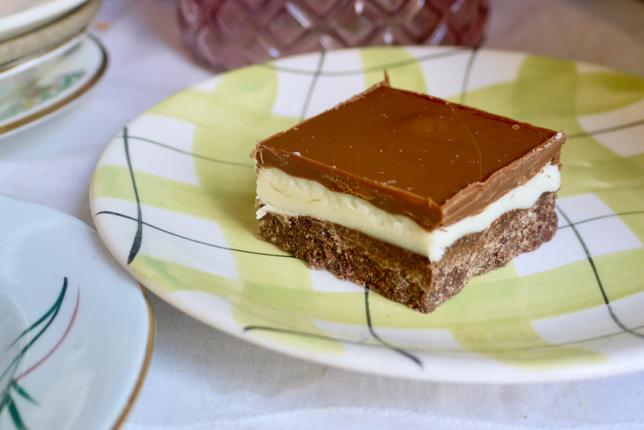 A square of peppermint slice on a green checked plate