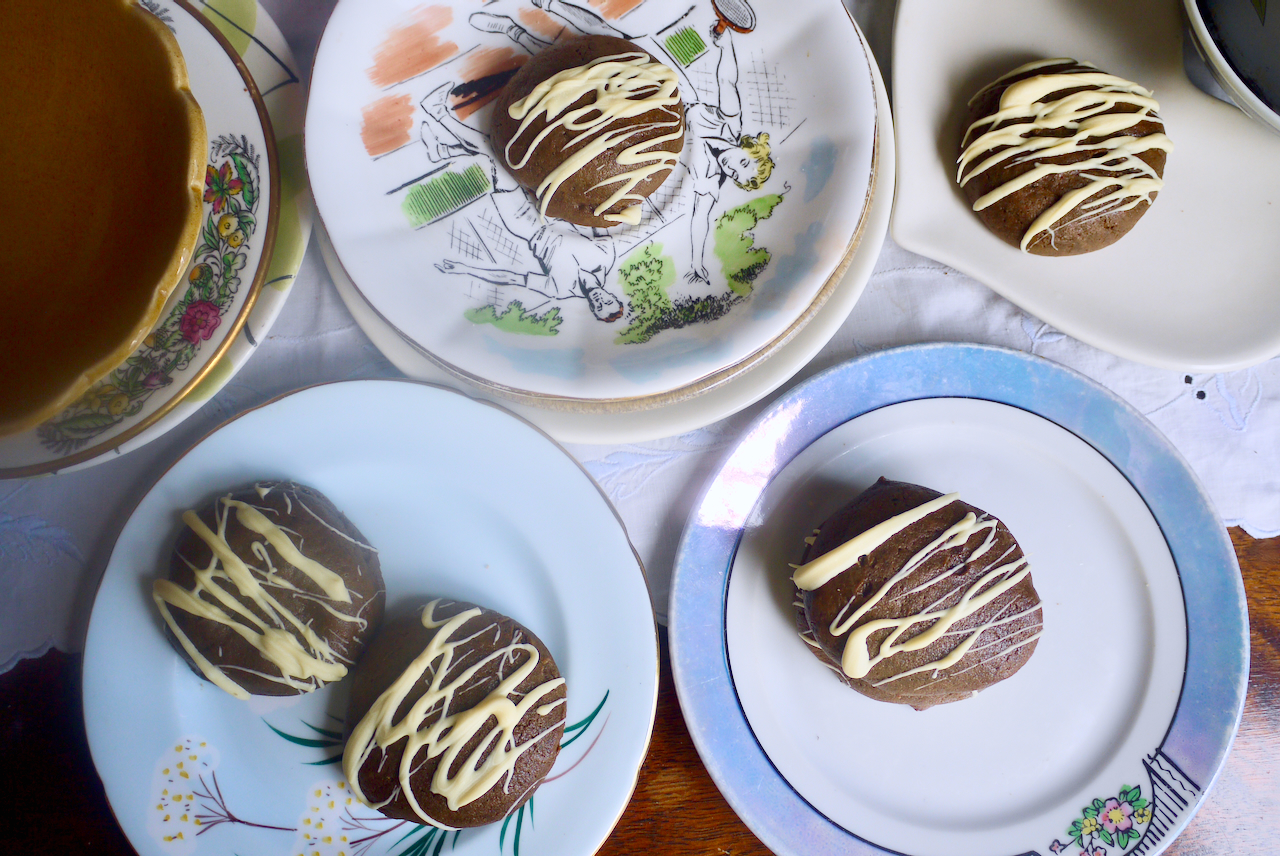 Molasses cookies on small, different-coloured plates