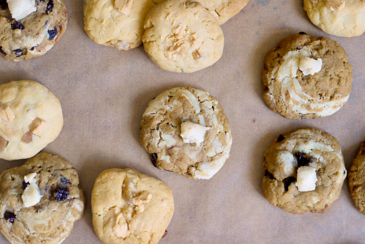 Artlessly arranged cookies on a sheet of baking paper