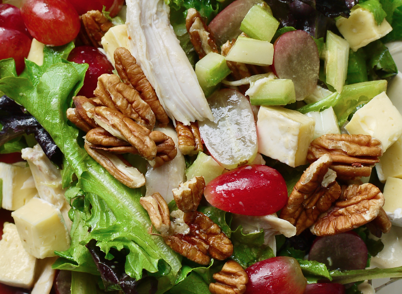 Close up of a chicken, red grape, pecan and brie salad