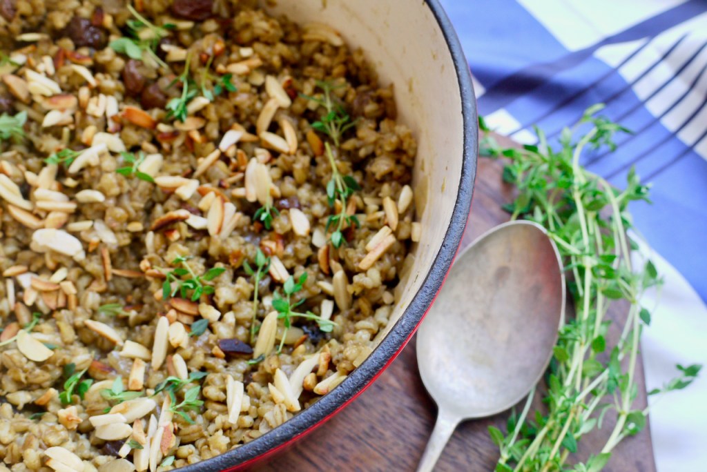 A close up of barley pilaf in a casserole dish