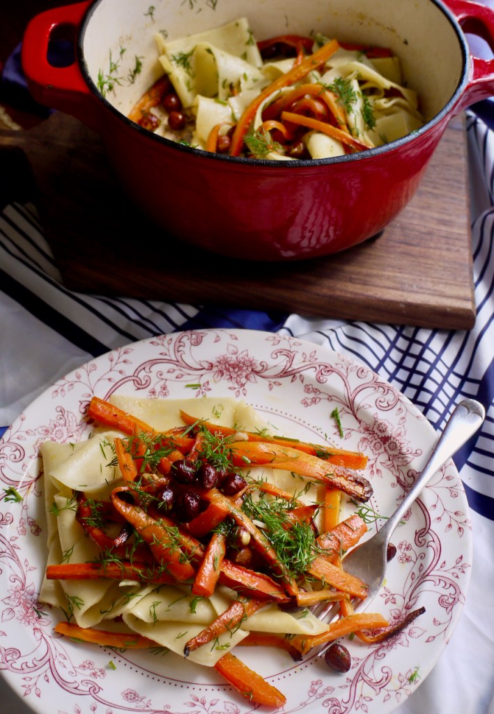 A plate of pappardelle in front of a saucepan of pasta.jpeg