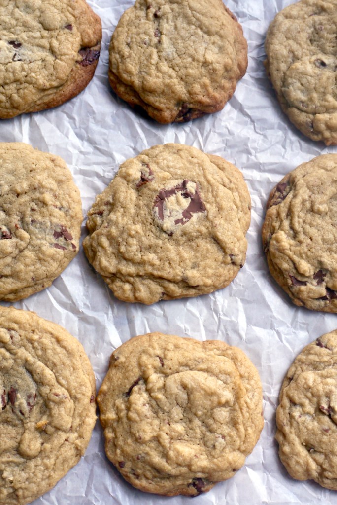 cookies lined up evenly on a sheet of baking paper